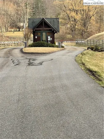 a view of the house with snow on the road