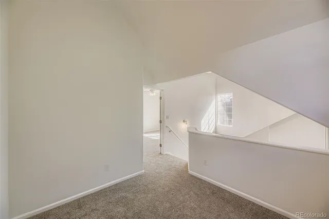 a view of a room that has a grey walls