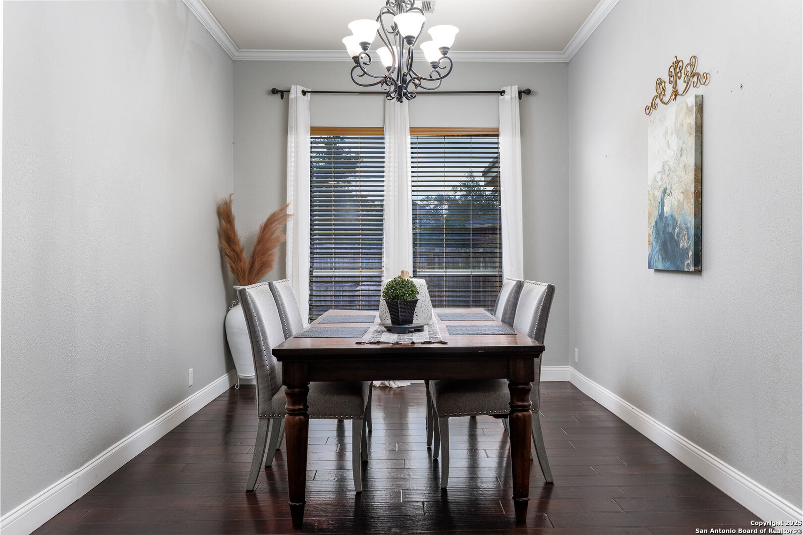 9026 Colfax Helotes, TX 78023 - Photo 12 of 40 a view of a dining room with furniture wooden floor and a chandelier