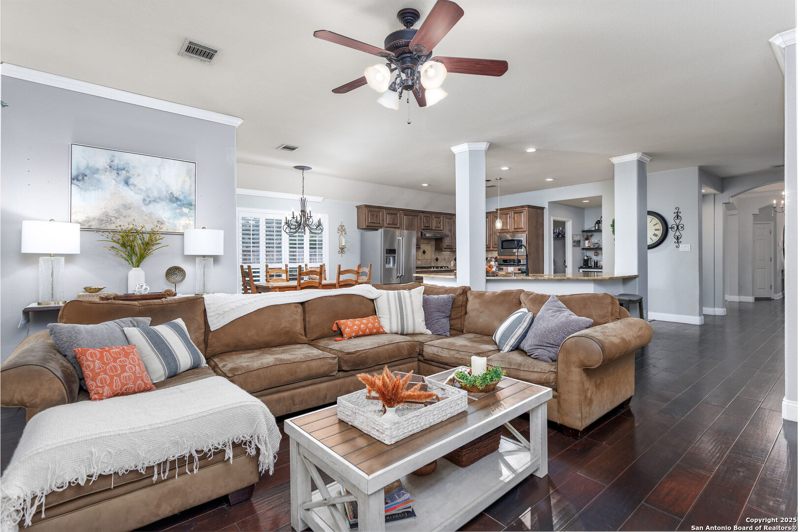 9026 Colfax Helotes, TX 78023 - Photo 14 of 40 a living room with furniture kitchen view and a chandelier