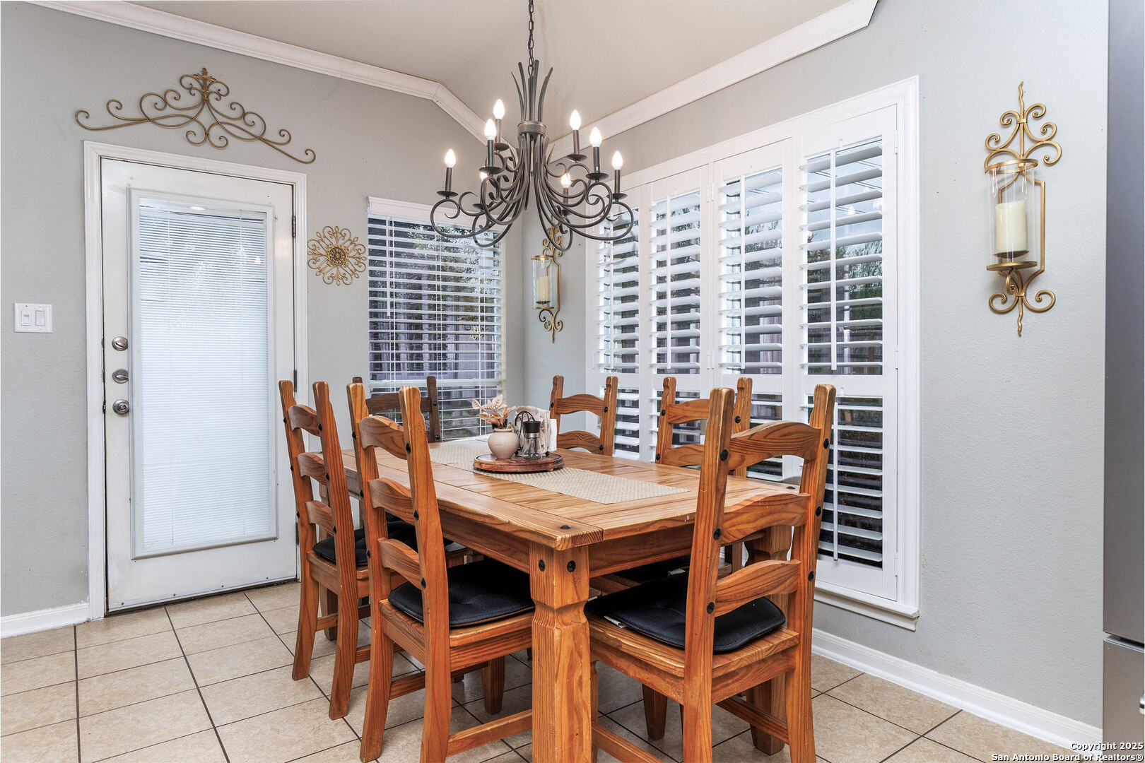 9026 Colfax Helotes, TX 78023 - Photo 20 of 40 a view of a dining room with furniture and chandelier
