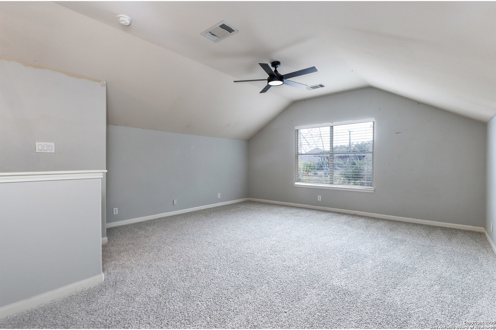 9026 Colfax Helotes, TX 78023 - Photo 35 of 40 an empty room with a window and ceiling fan