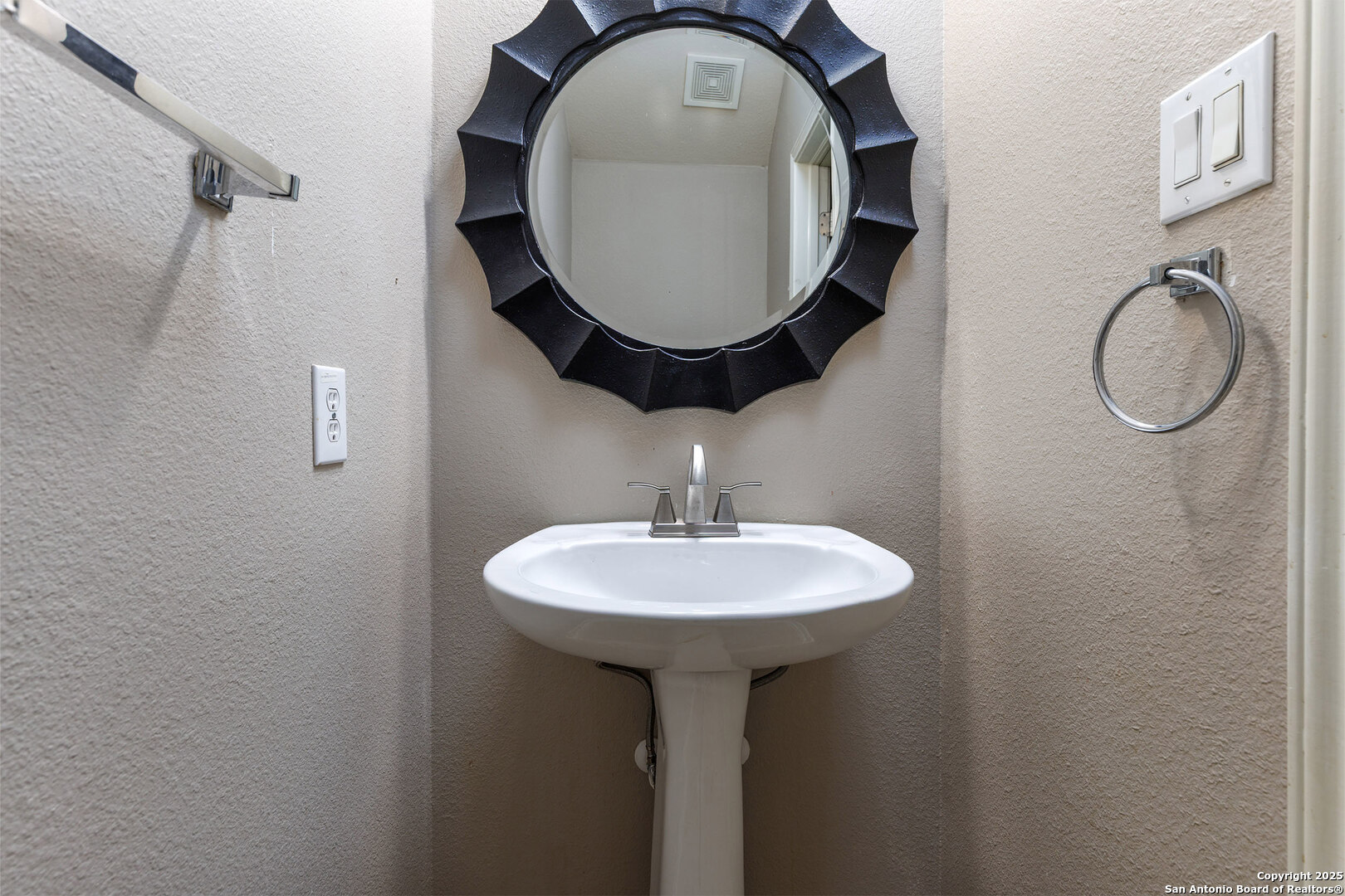 9026 Colfax Helotes, TX 78023 - Photo 36 of 40 a bathroom with a sink and mirror