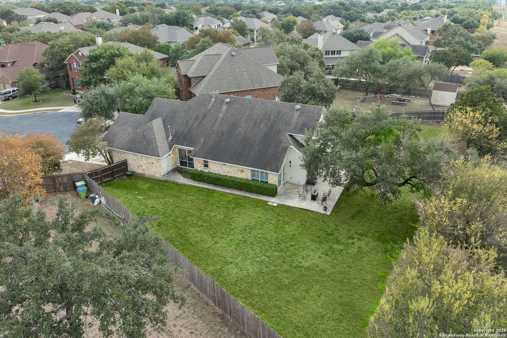 9026 Colfax Helotes, TX 78023 - Photo 7 of 40 an aerial view of a house with a yard