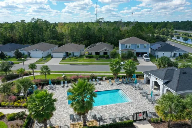 an aerial view of a house with a garden