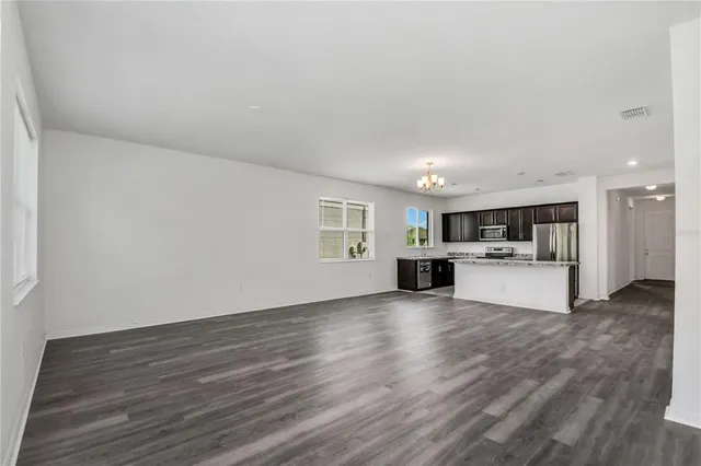 a view of kitchen with furniture and wooden floor
