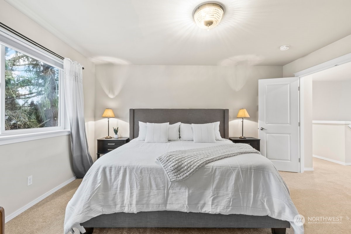 19005 Grannis Road Bothell, WA 98012 - Photo 12 of 31 a bedroom with a bed and window