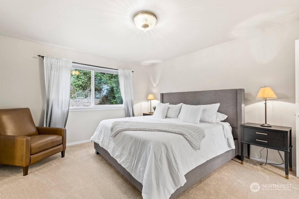 19005 Grannis Road Bothell, WA 98012 - Photo 13 of 31 a bedroom with a bed and a couch