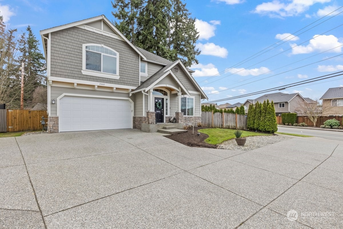 19005 Grannis Road Bothell, WA 98012 - Photo 20 of 31 a view of a house with a outdoor space and porch