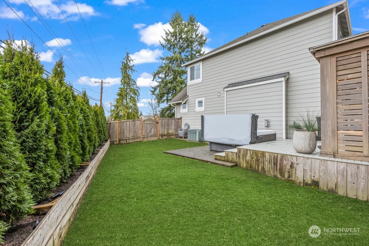 19005 Grannis Road Bothell, WA 98012 - Photo 21 of 31 a view of a house with backyard and a garden