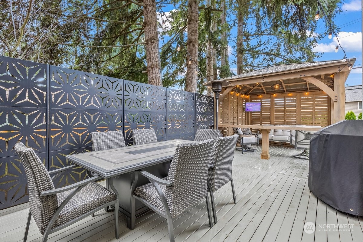 19005 Grannis Road Bothell, WA 98012 - Photo 24 of 31 a view of a patio with a table and chairs