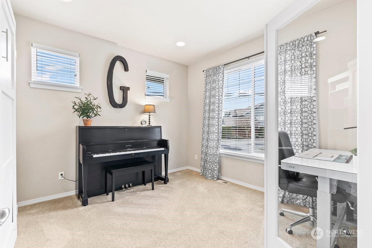 19005 Grannis Road Bothell, WA 98012 - Photo 3 of 31 a room with furniture and a window