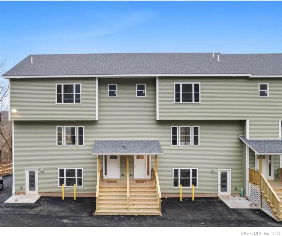 455 Sherman Avenue Hamden, CT 06518 - Photo 1 of 1 a front view of a house with a yard