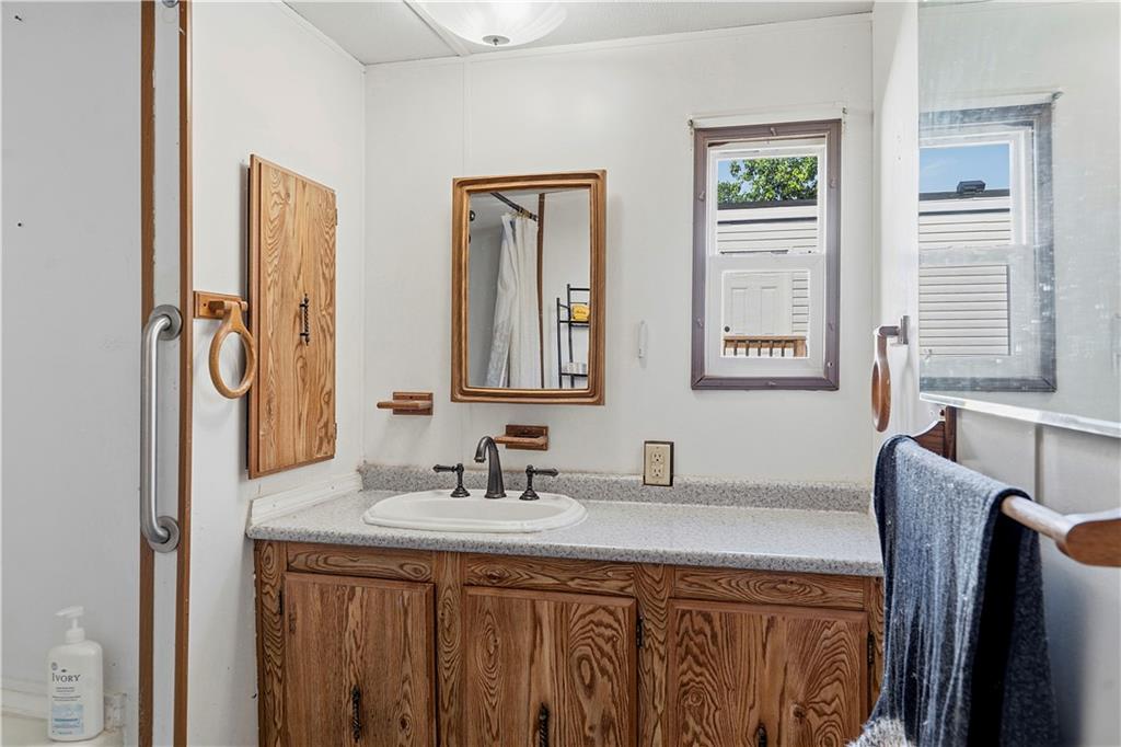 1300 Hidden Valley Road Bulger, PA 15019 - Photo 21 of 25 a bathroom with a sink a mirror and a window