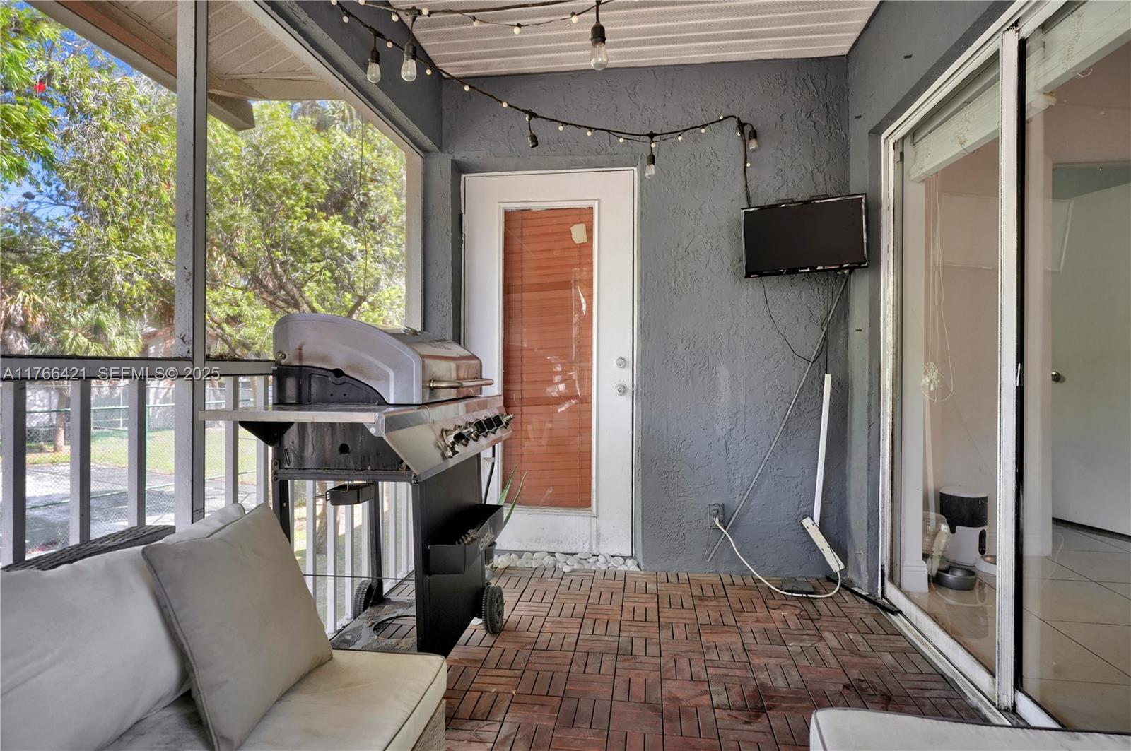 9503 Southwest 140th Court, Unit 9503 Miami, FL 33186 - Photo 13 of 32 a view of entryway with furniture and a window