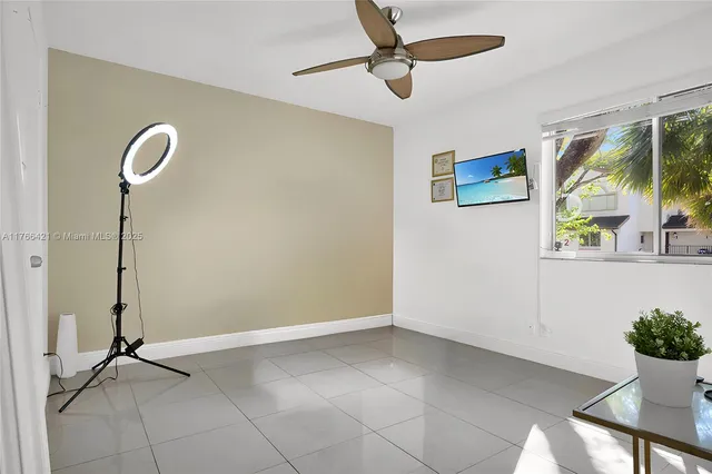 a view of an empty room with a potted plant