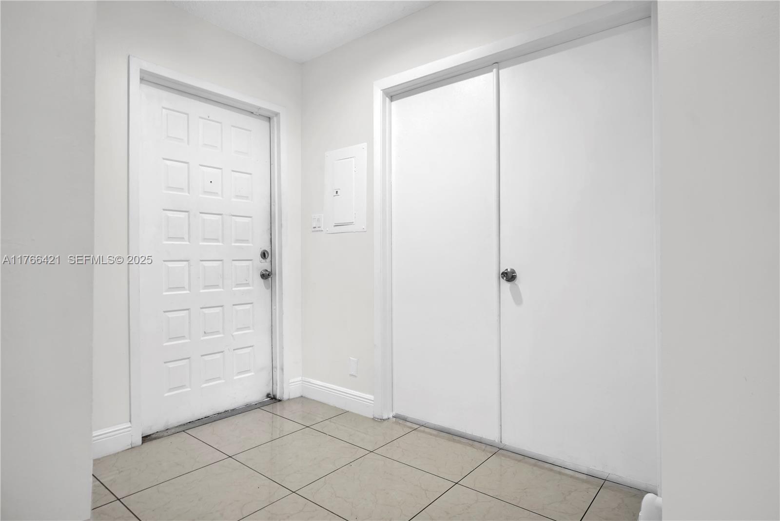 9503 Southwest 140th Court, Unit 9503 Miami, FL 33186 - Photo 17 of 32 an empty room with closet