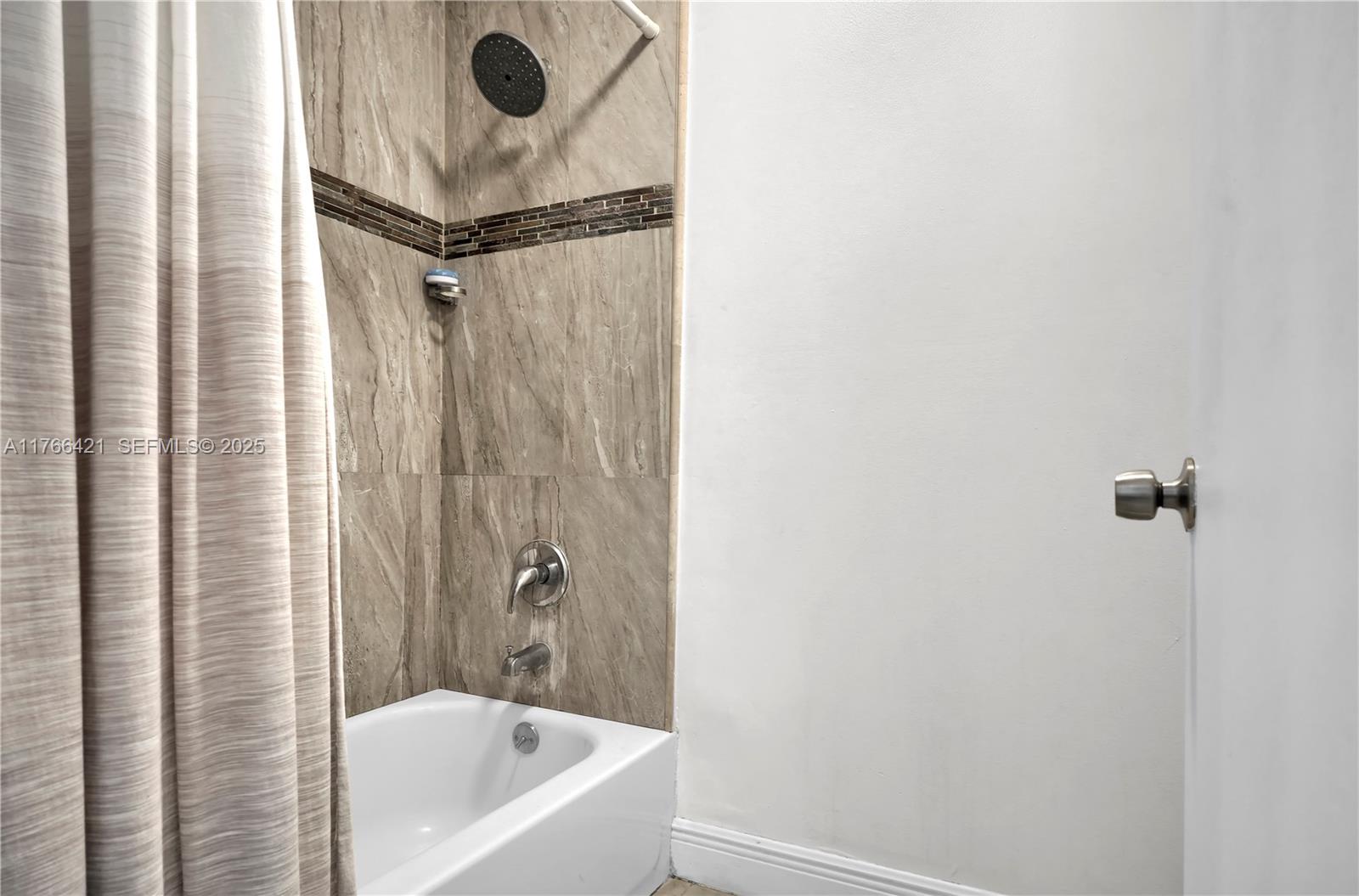 9503 Southwest 140th Court, Unit 9503 Miami, FL 33186 - Photo 20 of 32 a bathroom with a bathtub and a shower