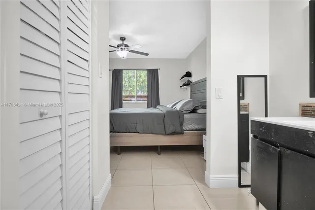 a en suite bathroom with a sink and a mirror