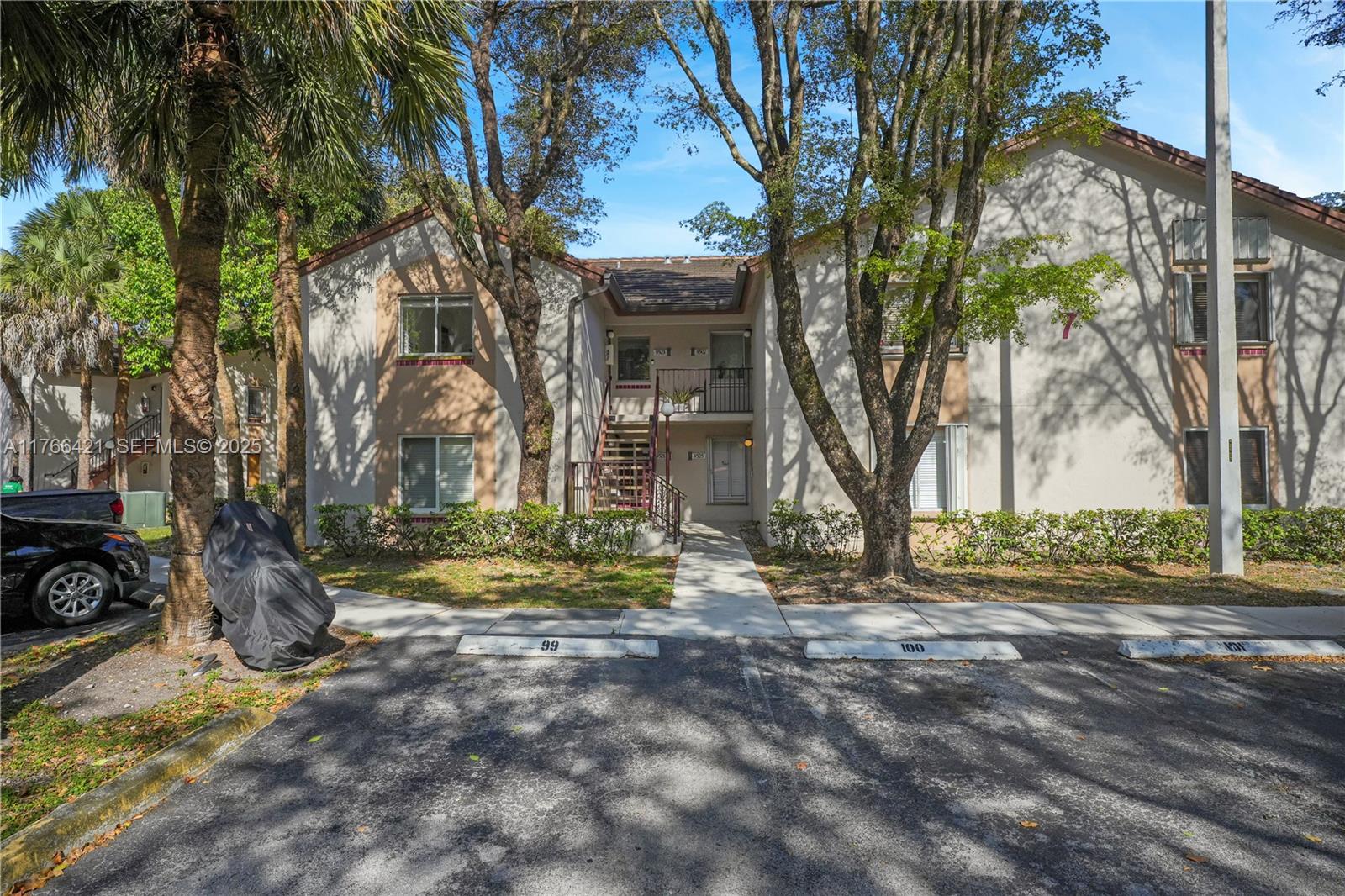 9503 Southwest 140th Court, Unit 9503 Miami, FL 33186 - Photo 28 of 32 a view of a house with a yard covered with snow