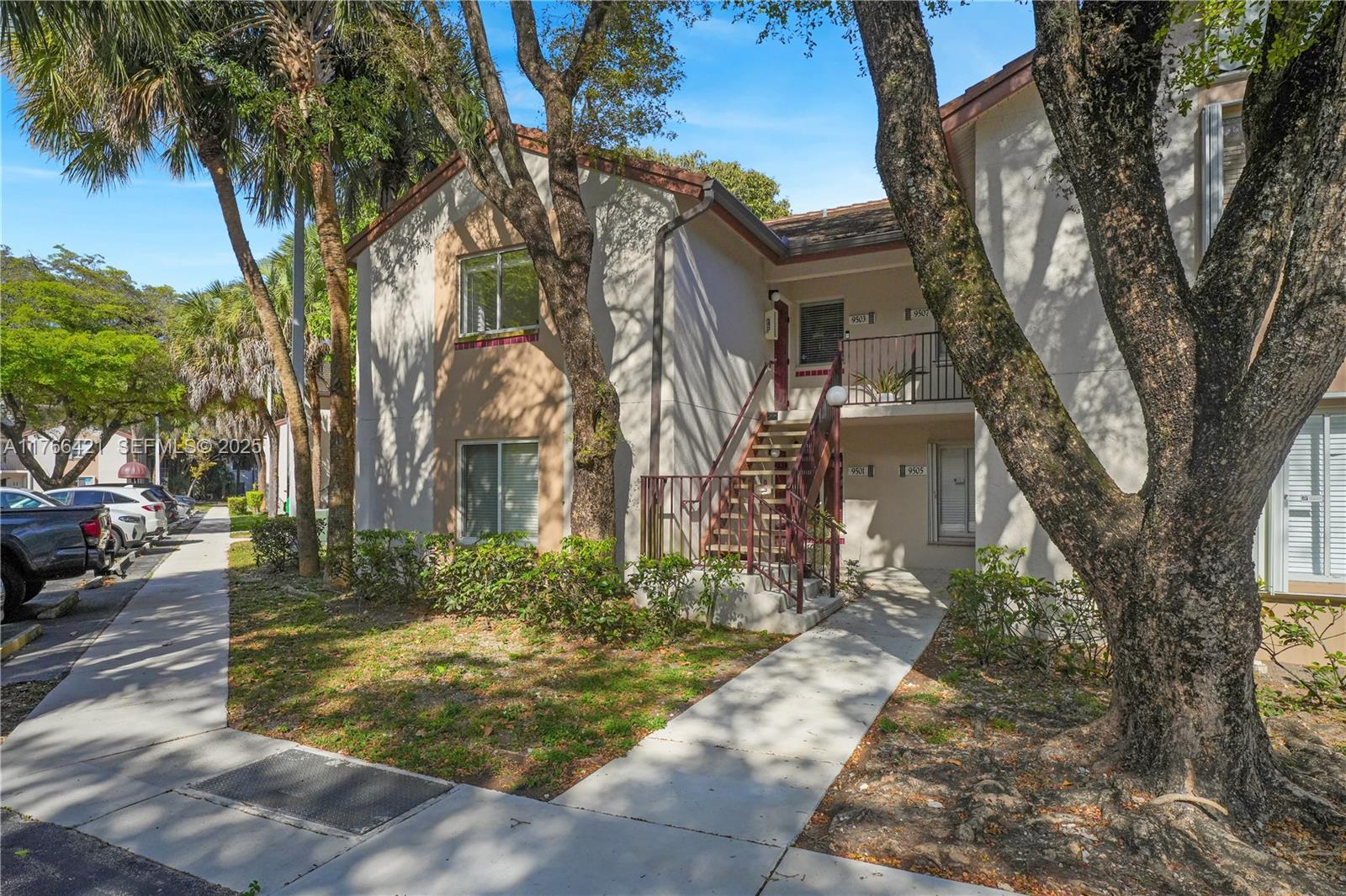 9503 Southwest 140th Court, Unit 9503 Miami, FL 33186 - Photo 29 of 32 front view of a house with a trees