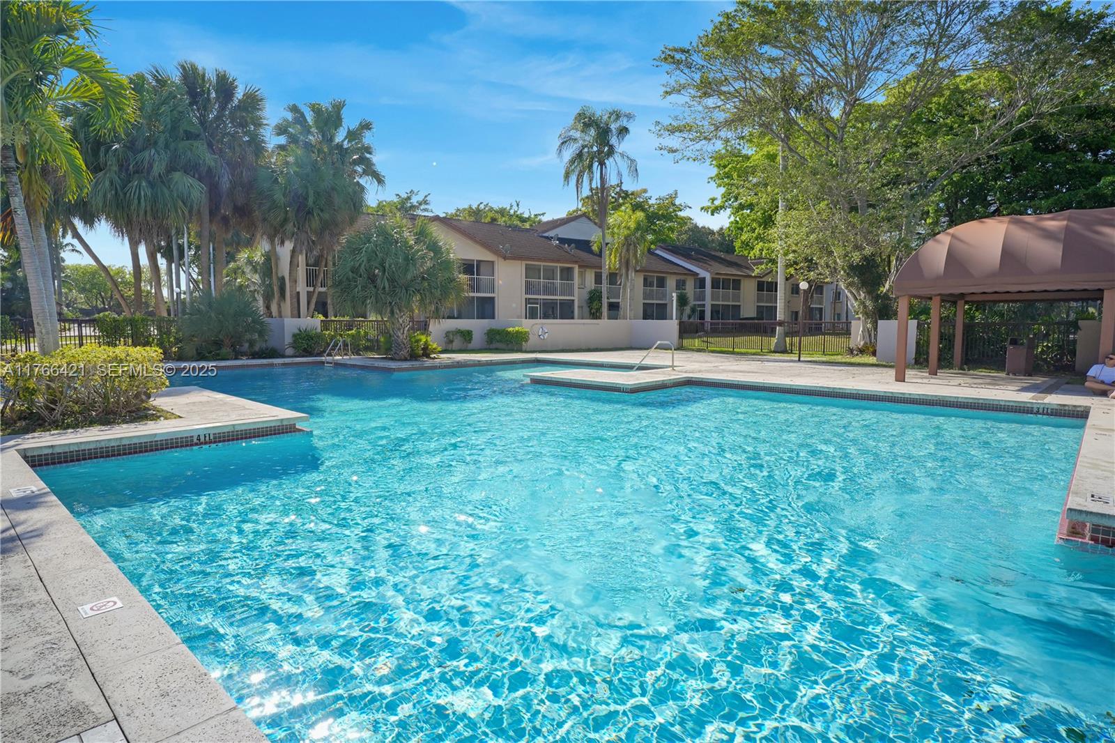9503 Southwest 140th Court, Unit 9503 Miami, FL 33186 - Photo 31 of 32 a front view of a house with garden