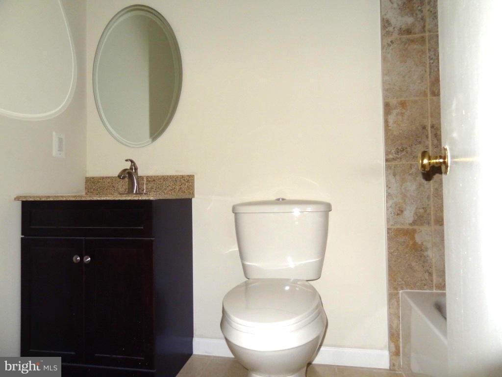 1808 Pepperidge Lane Reston, VA 20191 - Photo 14 of 24 a bathroom with a toilet and a sink