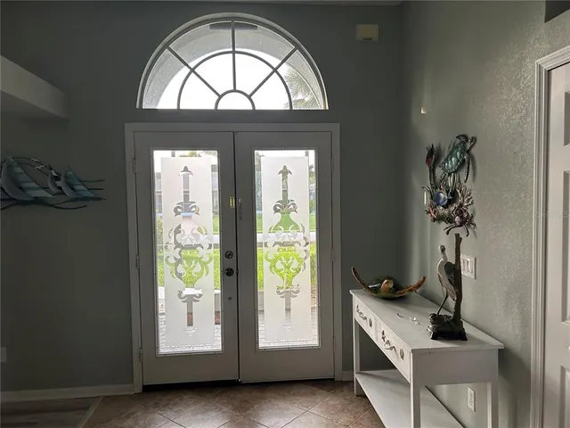 a view of an entryway with wooden floor