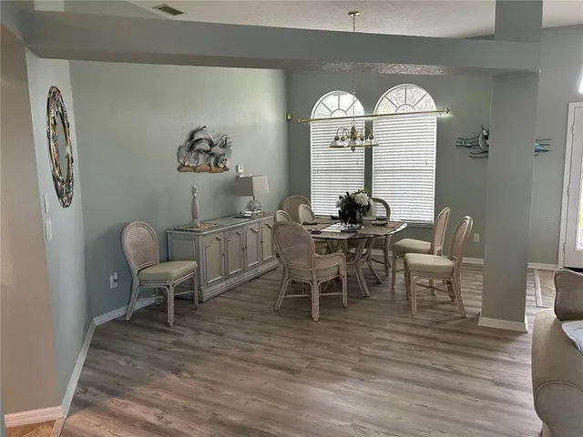 a view of a dining room with furniture window and outside view