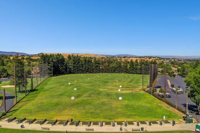 a front view of building with yard