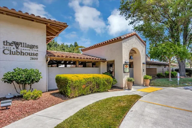 a room with lots of furniture and white cabinets