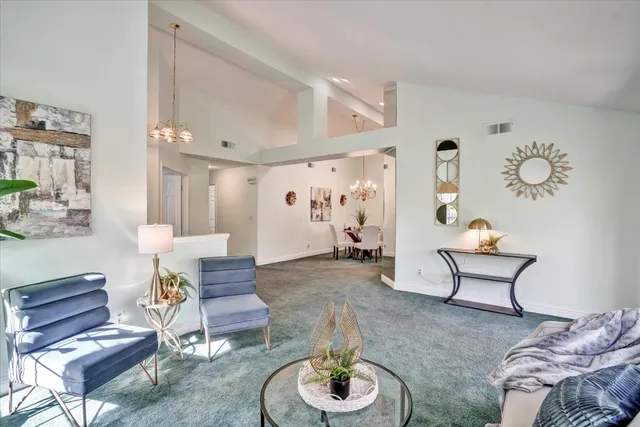 a living room with furniture and a table