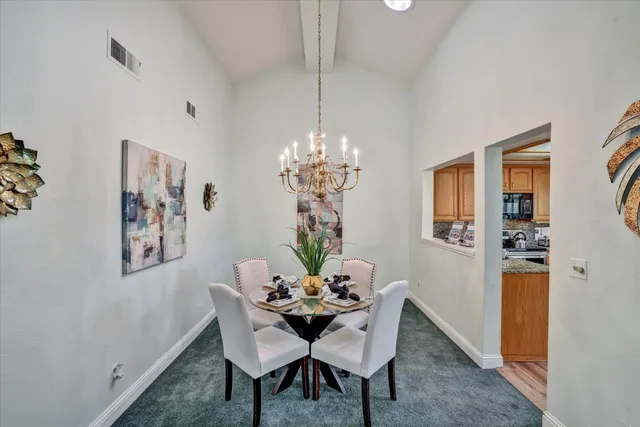 a dining room with furniture and window