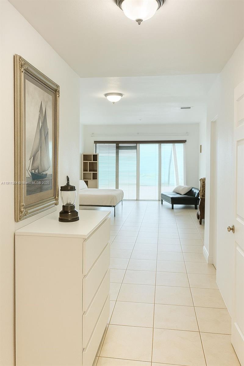 6345 Collins Avenue, Unit TH2 Miami Beach, FL 33141 - Photo 3 of 8 a room with a sink and a mirror