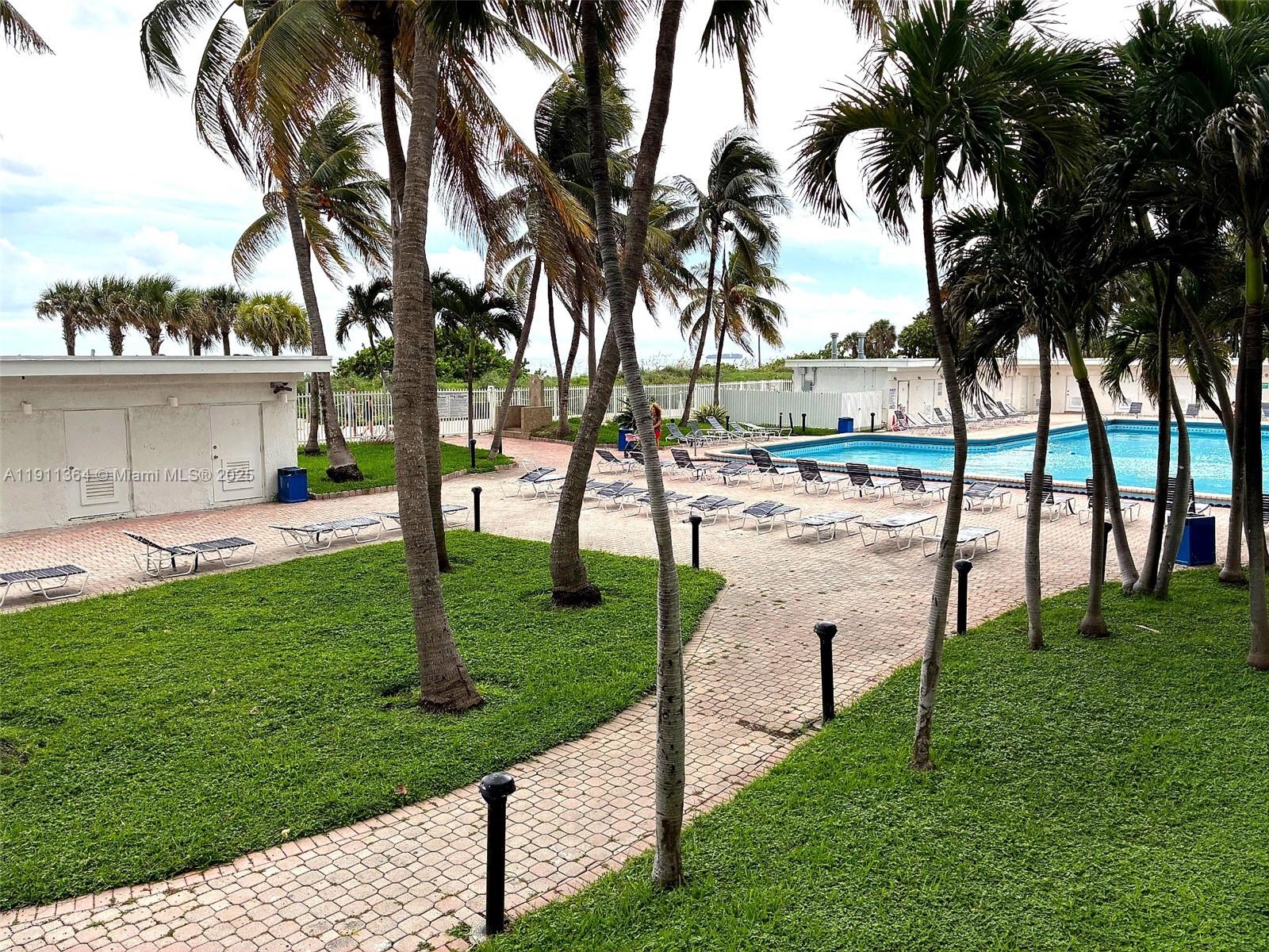 6345 Collins Avenue, Unit TH2 Miami Beach, FL 33141 - Photo 7 of 8 a view of a garden and trees