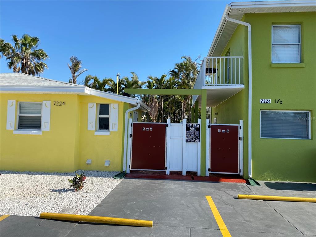 7224 Coquina Way, Unit 3 St. Pete Beach, FL 33706 - Photo 1 of 1 a view of a house with a swimming pool