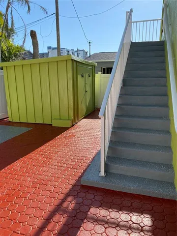 a view of a backyard of the house