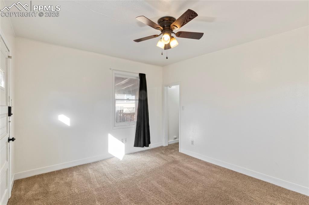 2620 Main Street Colorado Springs, CO 80907 - Photo 13 of 28 an empty room with windows and fan