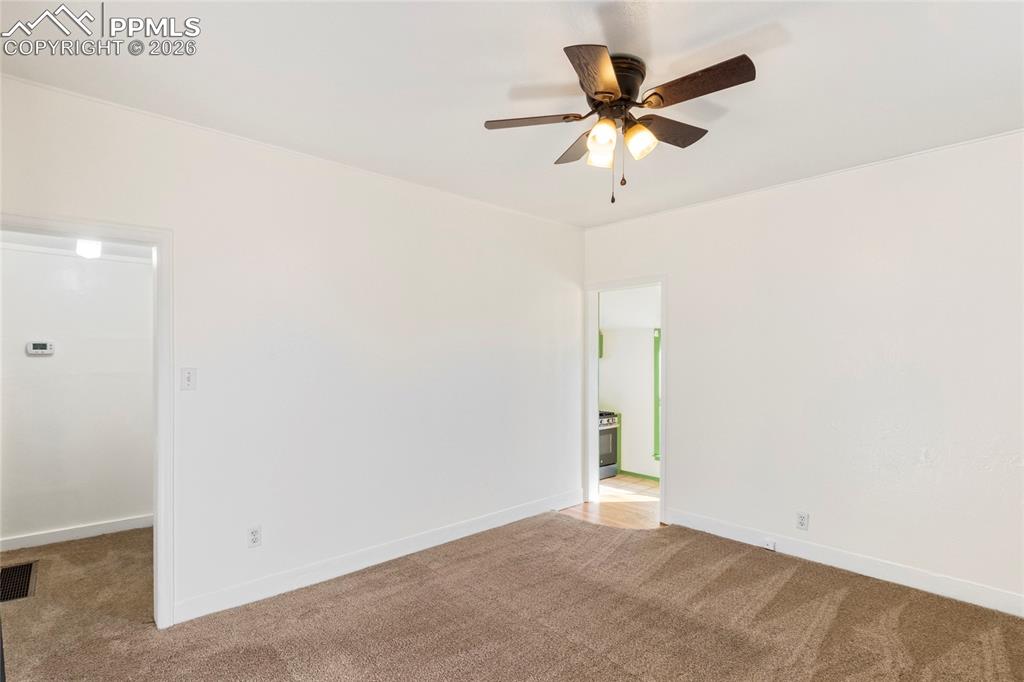 2620 Main Street Colorado Springs, CO 80907 - Photo 14 of 28 an empty room with closet and ceiling fan