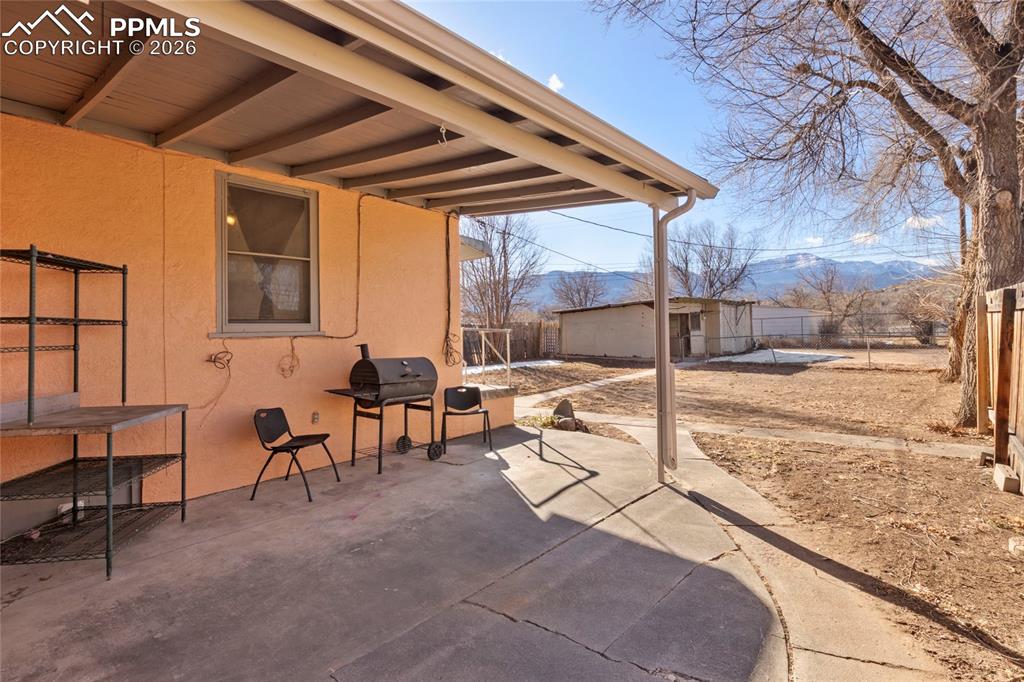2620 Main Street Colorado Springs, CO 80907 - Photo 23 of 28 a view of a porch with furniture and a yard