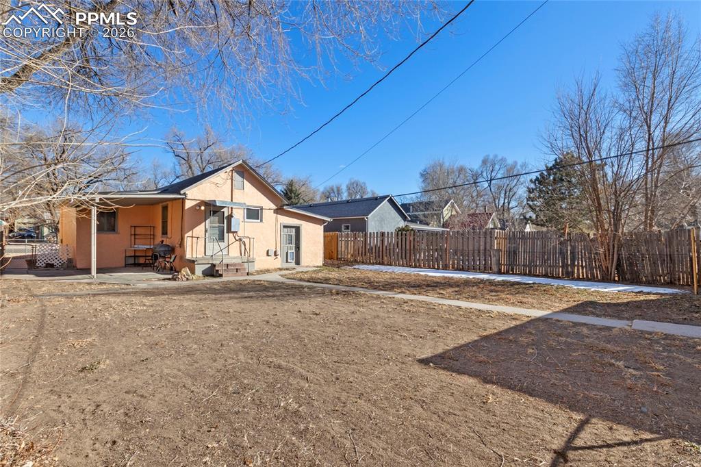 2620 Main Street Colorado Springs, CO 80907 - Photo 26 of 28 a view of a house with a yard and garage
