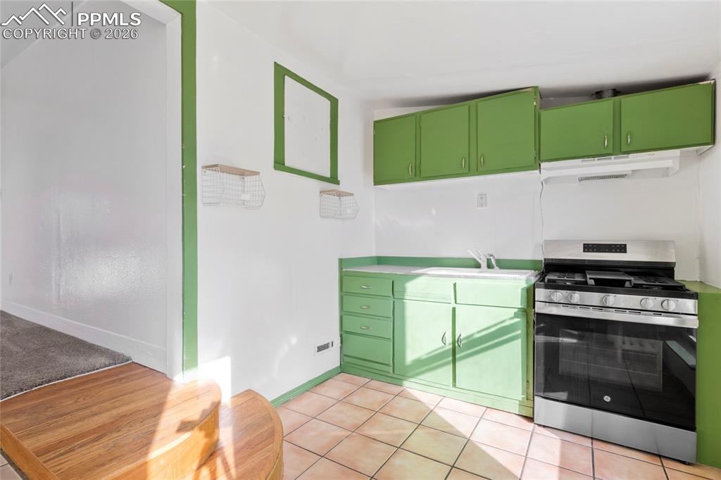 2620 Main Street Colorado Springs, CO 80907 - Photo 10 of 28 a kitchen with a stove and a microwave