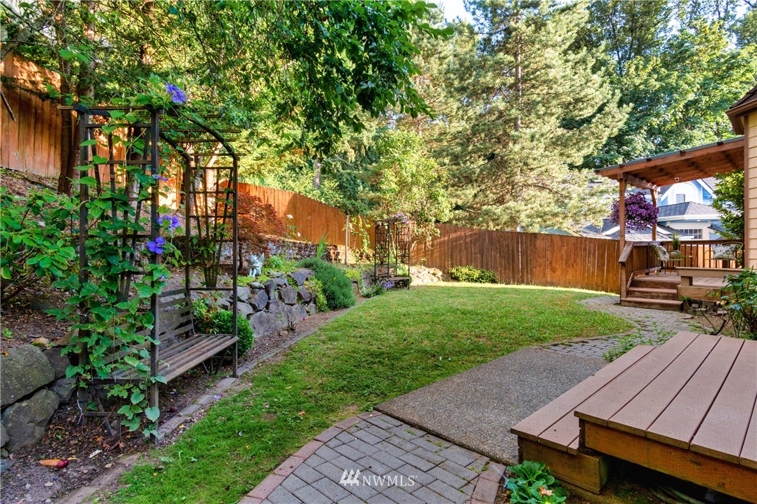 9645 South 194th Street Renton, WA 98055 - Photo 34 of 35 a view of a backyard with plants and a garden