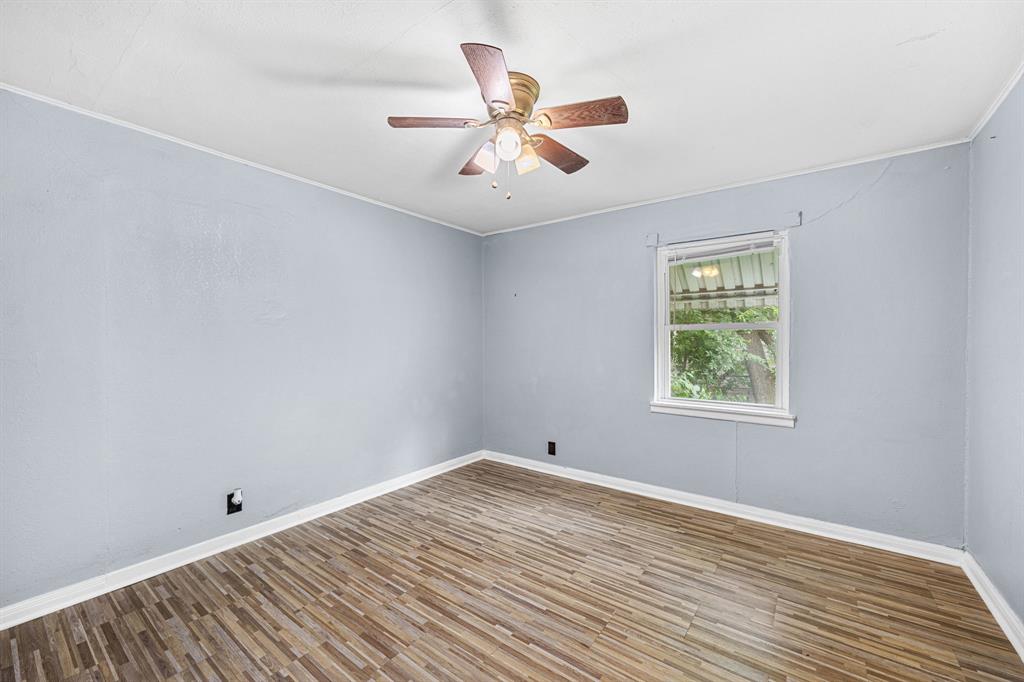 709 Sissom Road Killeen, TX 76541 - Photo 17 of 24 wooden floor in an empty room with a window