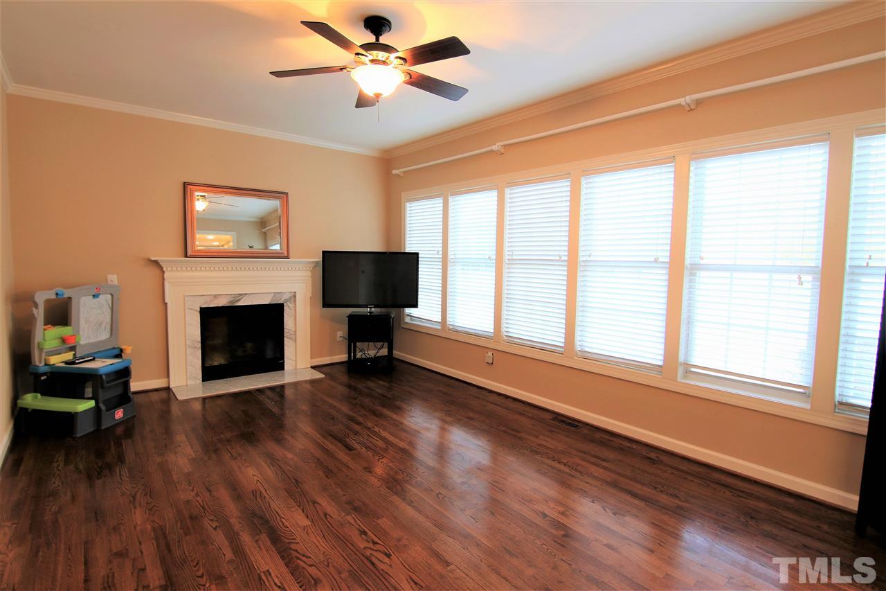 1005 Nortonbridge Road Raleigh, NC 27603 - Photo 3 of 25 a living room with furniture and a fireplace