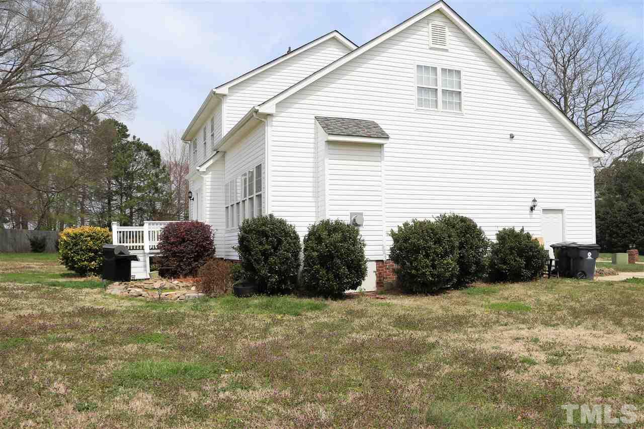 1005 Nortonbridge Road Raleigh, NC 27603 - Photo 22 of 25 a view of a house with backyard and sitting area