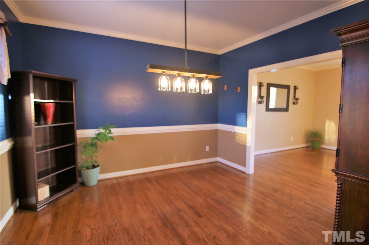 1005 Nortonbridge Road Raleigh, NC 27603 - Photo 8 of 25 wooden floor in an empty room with a window
