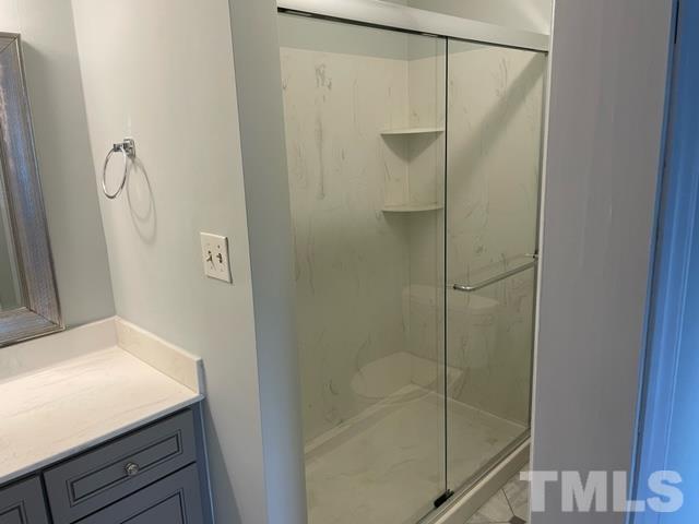 6325 New Market Way, Unit 6325 Raleigh, NC 27615 - Photo 12 of 13 a bathroom with a shower