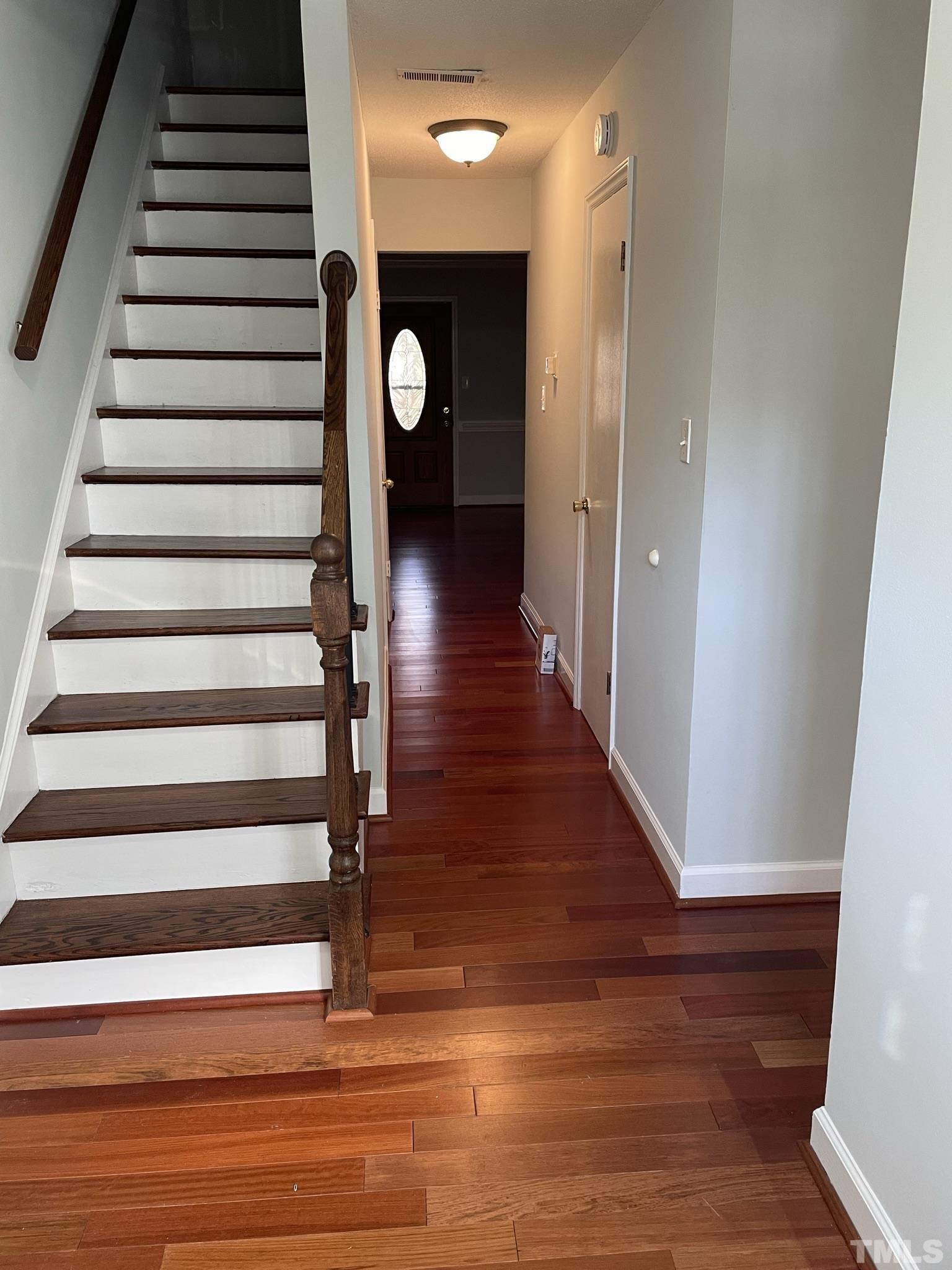 6325 New Market Way, Unit 6325 Raleigh, NC 27615 - Photo 3 of 13 a view of entryway with wooden floor