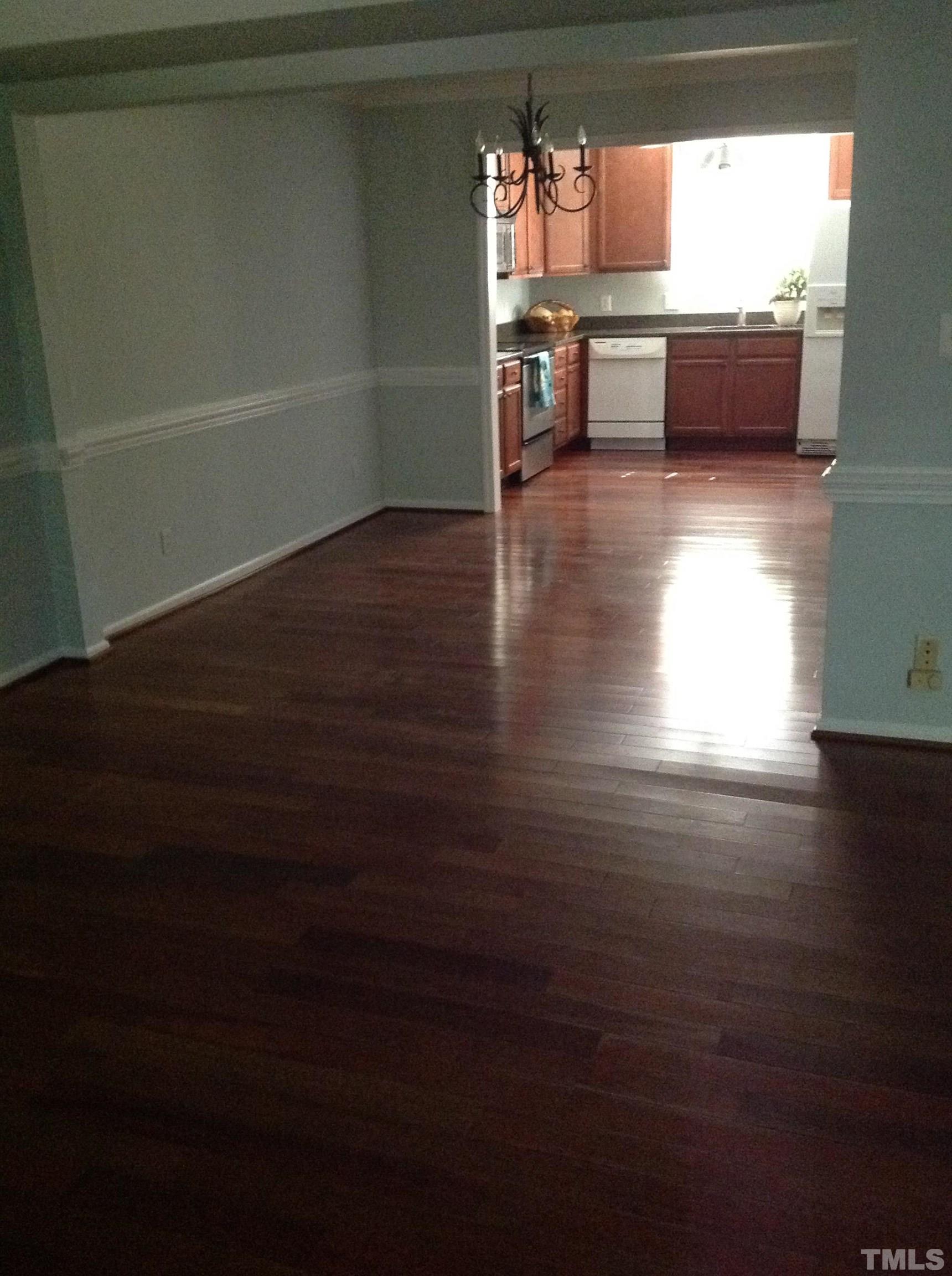 6325 New Market Way, Unit 6325 Raleigh, NC 27615 - Photo 6 of 13 a view of kitchen and dining room with wooden floor